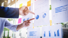 Businessman making presentation with his colleagues and business strategy digital layer effect at the office as concept.