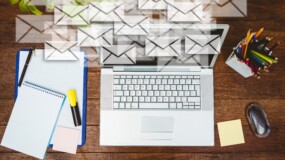 composite image of high angle view of business desk with letter icons