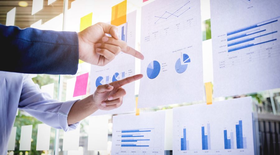 Businessman making presentation with his colleagues and business strategy digital layer effect at the office as concept.